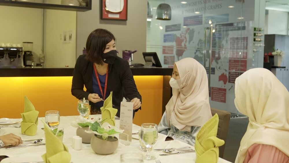 TCI lecturer Jasmine Chen demonstrated the proper way of using utensils according to Western dining etiquette.